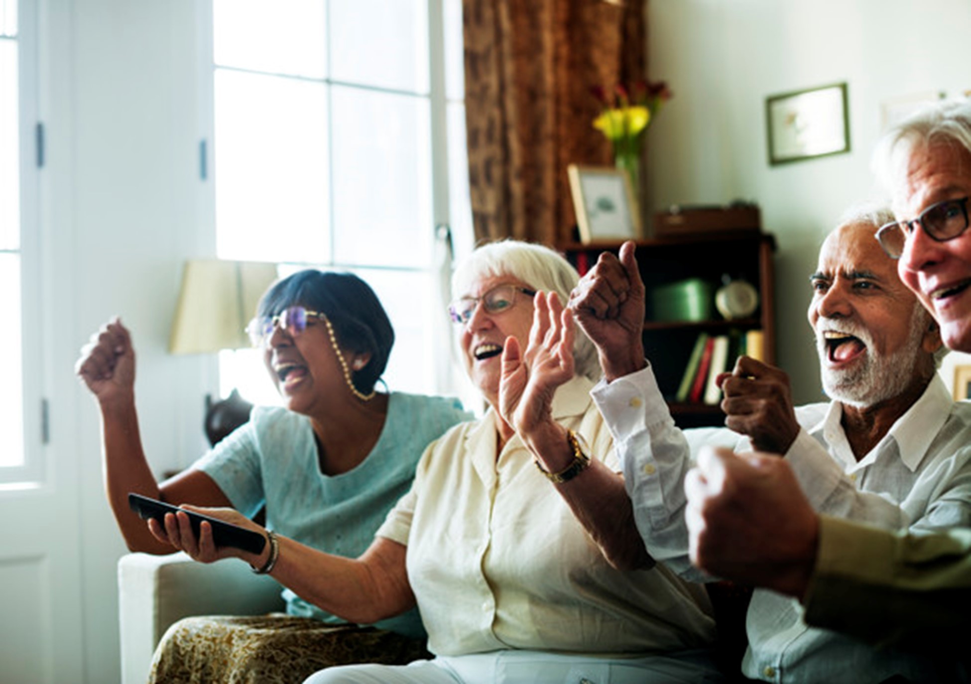 Group of elderly people watching TV